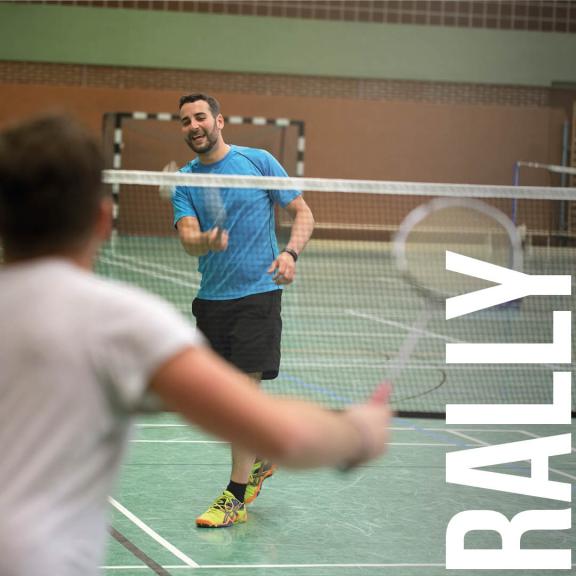 Father and son playing badminton with wording 'RALLY'