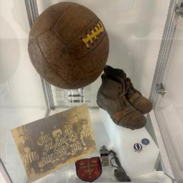 Museum Box with a football, football boots, picture of football team and badges